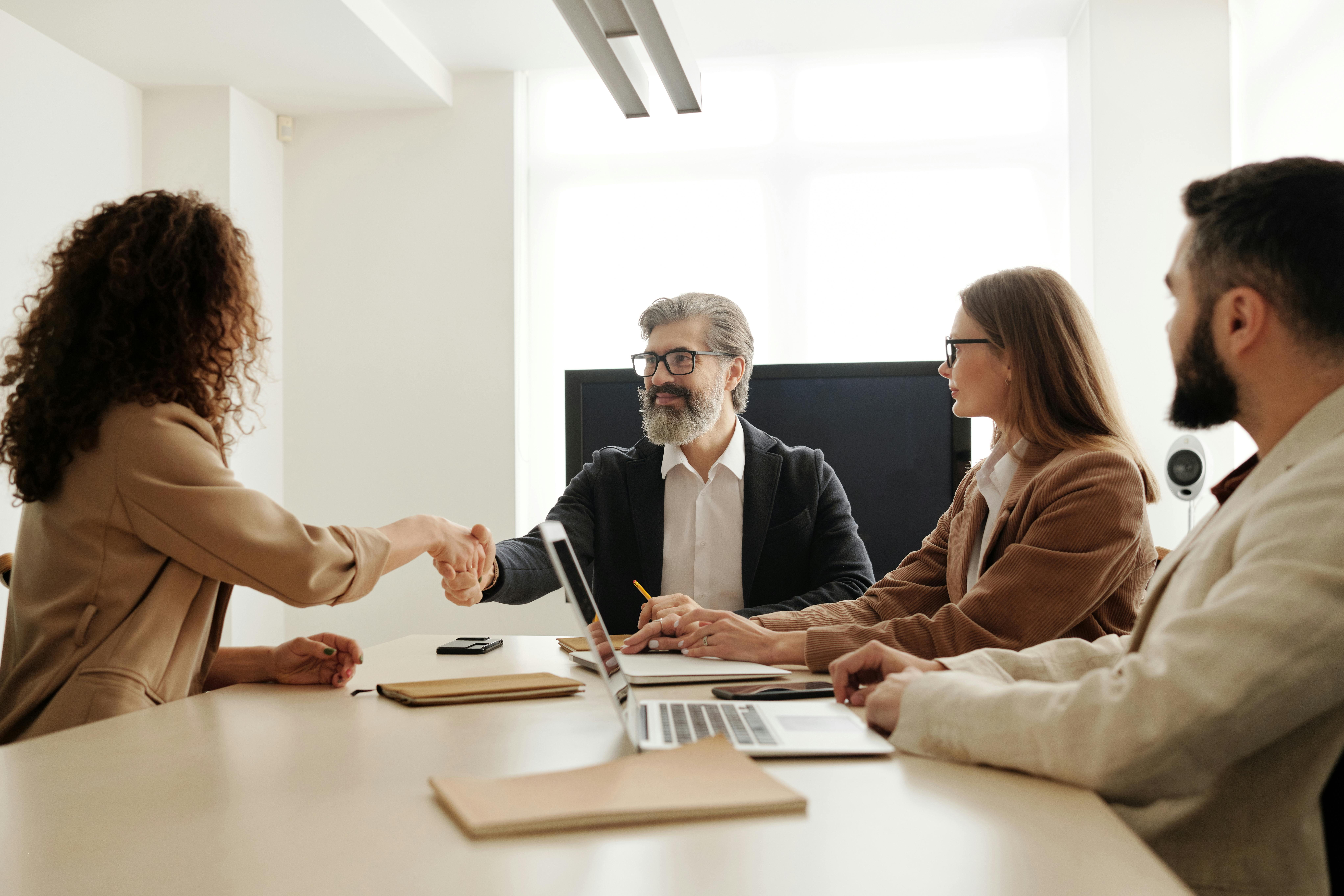 Employer meeting a job seeker across a desk